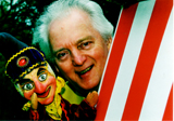 Close-up photo of John with Mr Punch